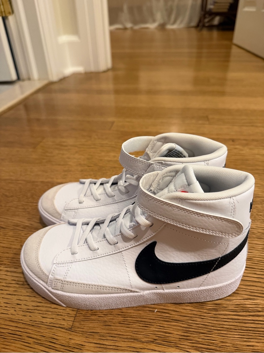 Nike Kids White High-Top Sneakers with Black Swoosh